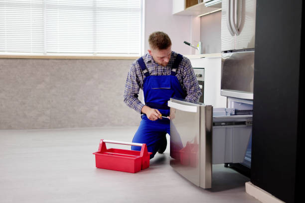 istock Electrician Technician Working To Repair Refrigerator 1466896561