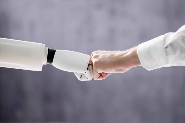 istock Robot And Human Hand Making Fist Bump 1466897290