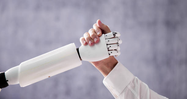 istock AI Robot And Human Man Hand 1466897307
