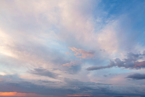 A pink sky with clouds in the sky