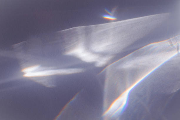 istock Sunlight background, abstract backdrop with light and shadow, glare and shine on paper texture, rainbow sun flare, blue violet color aesthetic image. Natural beams light, caustics effect 1466898028
