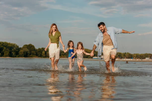 istock Happy parents and their small kids 1466900482