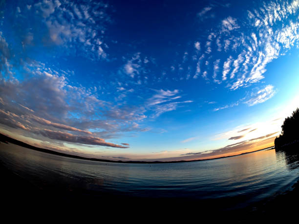 istock morning sky over a lake with rare clouds 1466900828