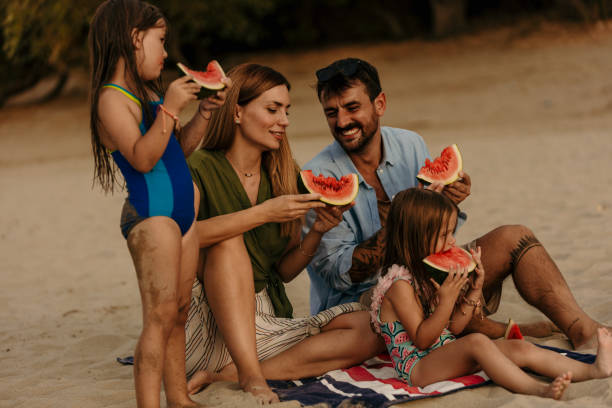 istock Modern family on the beach 1466901045