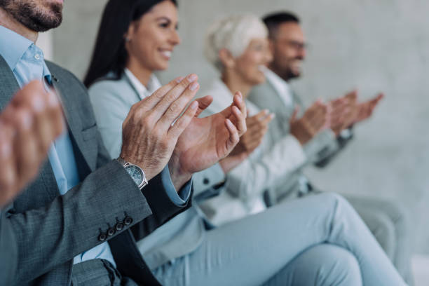 istock Businesspeople applauding during a seminar in conference hall. 1466901114