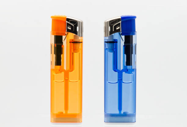 istock Blue and orange lighters isolated on white background. 1466905637