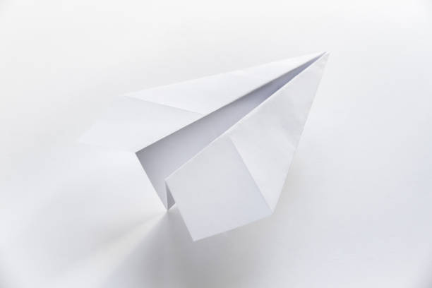 istock Paper plane origami isolated on a white background 1466906273