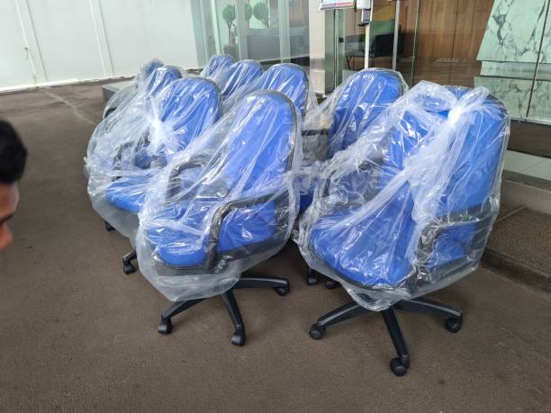 istock some office chairs that are new and still wrapped in plastic. 1466911326