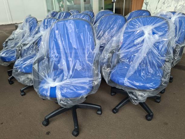 istock some office chairs that are new and still wrapped in plastic. 1466911461