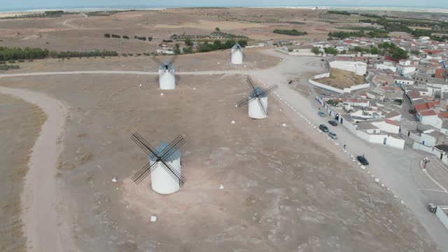 Aerial view of a poetic landscape of white windmills that could suit Don Quijote de La Mancha written by Miguel de Cervantes Saavedra.