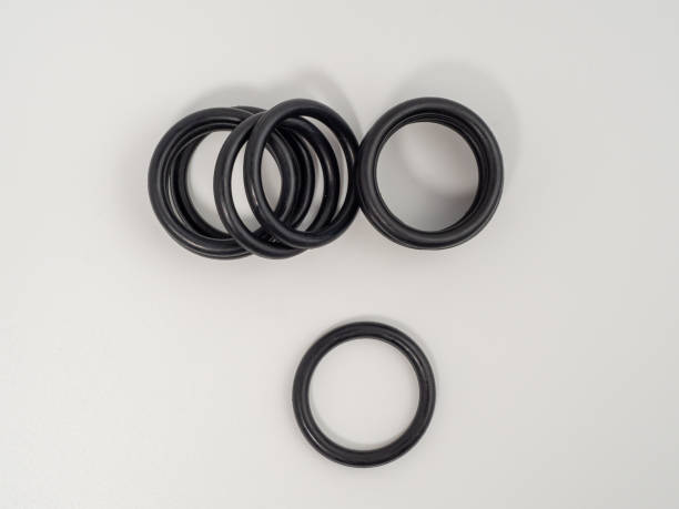 istock Hydraulic and pneumatic o-rings in black in different sizes on a white background. Rubber gaskets for plumbing. 1466912193