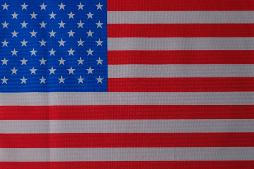 Abstract exploding American flag on white background.