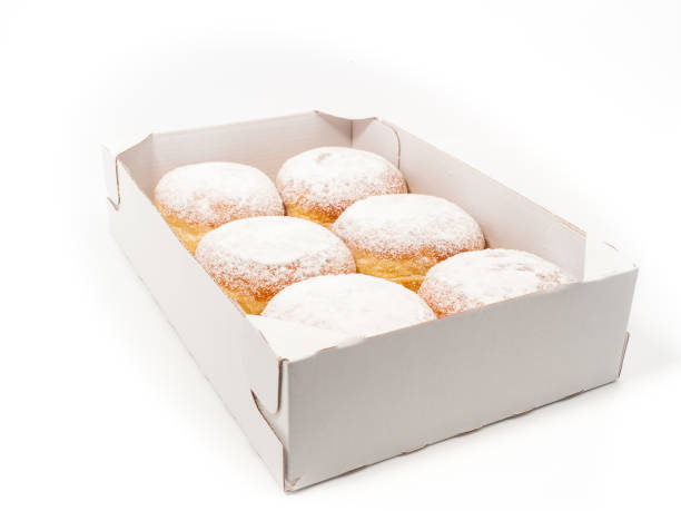 istock Freshly baked and dusted with powdered sugar German donuts. 1466918608