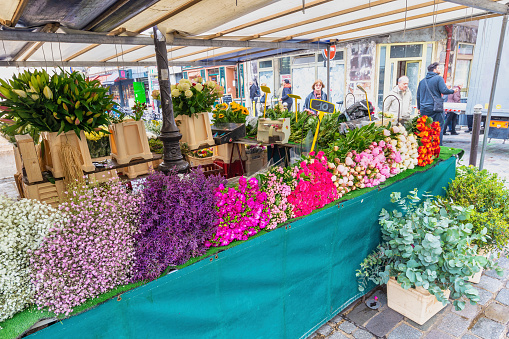 Paris, France - May 4, 2017: fresh flowers retail shop at Aligre Market in Paris