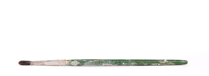 Small old paintbrush isolated on white background
