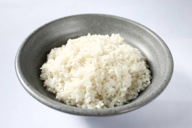istock a bowl of white rice, isolated on a white background 1466927308