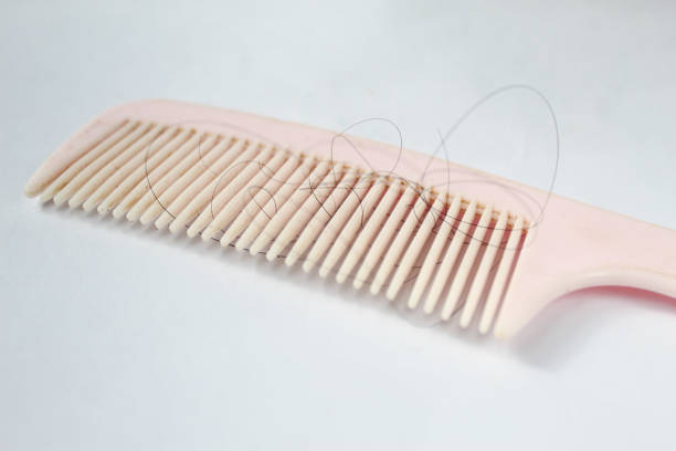 istock comb and loose hair, isolated over white background 1466927661
