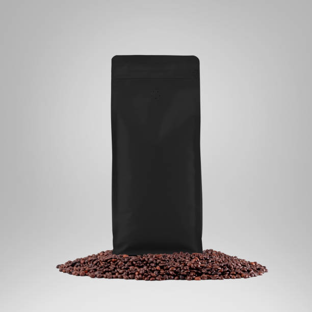 istock Black gusset packaging mockup with degassing valve, presentation of stable pouch on coffee beans, isolated on background. 1466930175