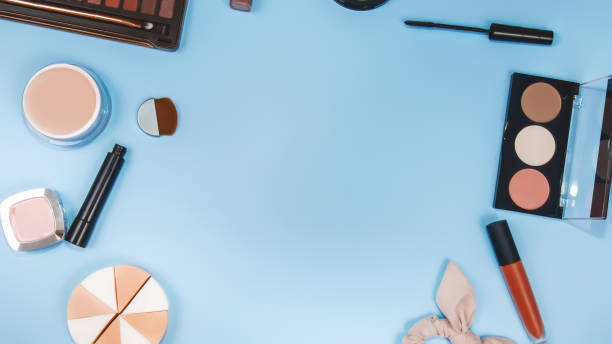 istock set of professional decorative cosmetics, makeup tools and accessory on colorful blue background. beauty and fashion concept. flat lay composition, top view 1466933855