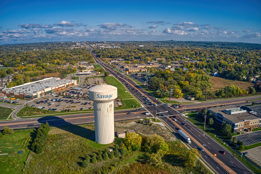 An aerial view of the Twin Cities Outer Suburb of Savage under a blue sky with clouds in Minnesota