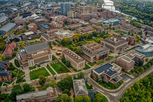 An aerial view of dense buildings and a large public University in Minneapolis, Minnesota