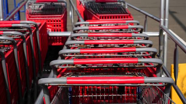 istock Red shoppinng carts outside on parking 1466938984