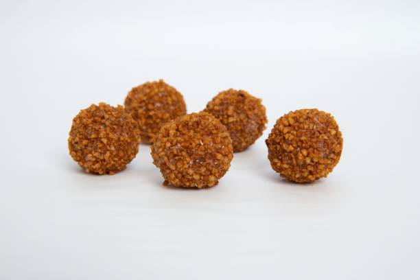 istock Sweet chocolate balls isolated on white background 1466939445