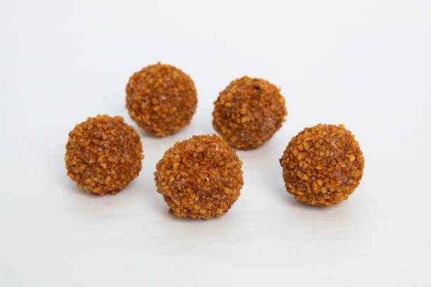 istock Sweet chocolate balls isolated on white background 1466939447