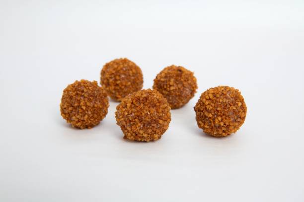 istock Sweet chocolate balls isolated on white background 1466939450