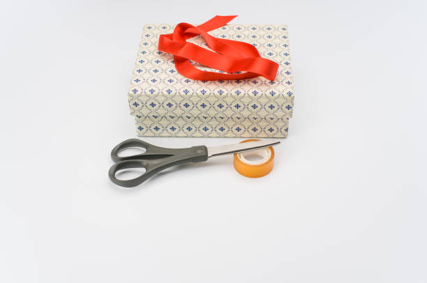 istock decorated paperboard box with lid on top and stationery on a white tabletop 1466940385