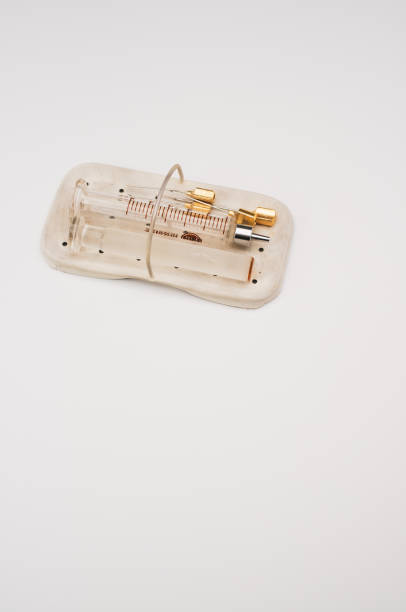 istock sterilized glass injection syringe in a box on  a white surface 1466940453