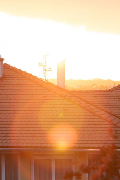 istock Vertical shot of the sunset over a roof 1466941114
