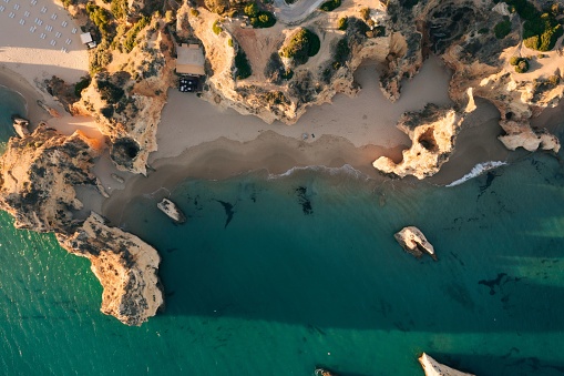 Praia da Prainha beach and Praia dos tres irmaos beach from above, aerial photo of Algarve coastline, Portugal