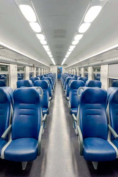 istock Vertical shot of an empty intercity train with modern interior and blue seats 1466945803