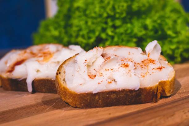 istock Closeup of fat spread on bread with chili pepper 1466947078