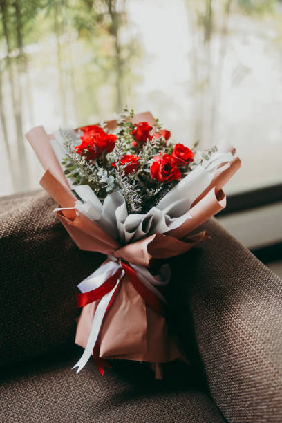 istock Bouquet of red roses on a couch 1466947647