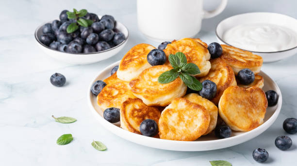 istock Homemade mini pancakes with blueberries. Copy Space for text 1466948296