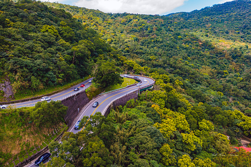 a overhead shot of raod going through the mountain