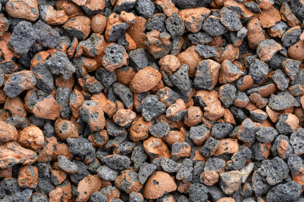 istock Texture background of orange and black stones 1466950603