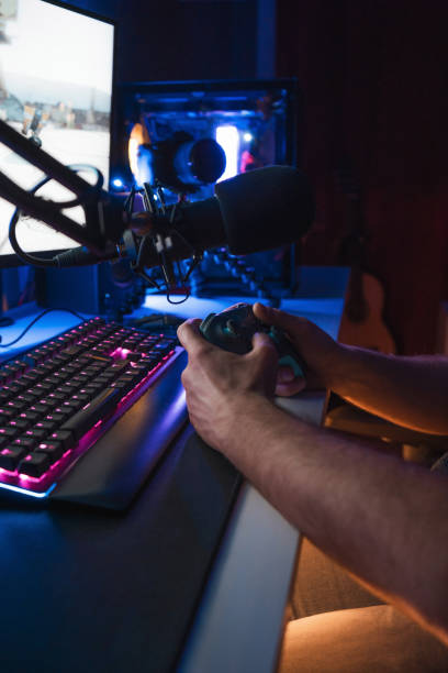 istock Gamer playing in his dark room 1466950807