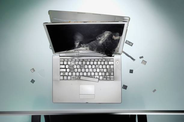 istock Closeup of a broken laptop on the table 1466952380