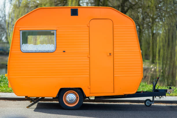 istock Small orange caravan outdoors 1466954125
