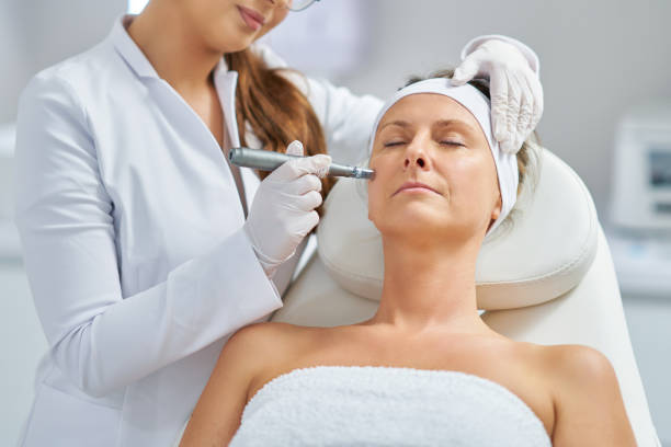 Woman in a beauty salon having needle mesotherapy treatment stock photo