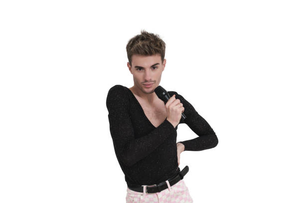 Young caucasian man smiling with a microphone. Isolated over white background.