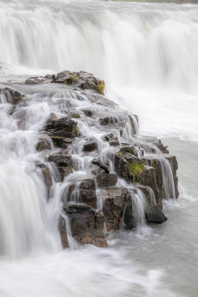 istock Beautiful landscape of a smooth silky waterfall 1466959305