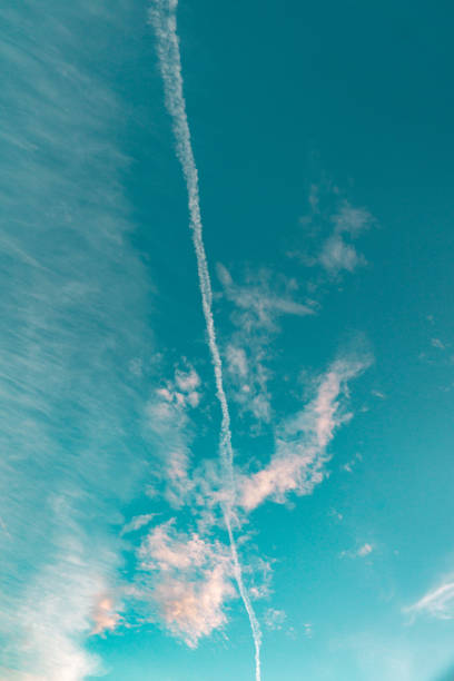 A vertical shot of a blue cloudy sky above Southern Chile