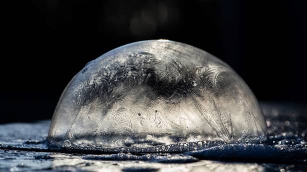 istock Closeup of a frozen bubble on a dark background 1466962585
