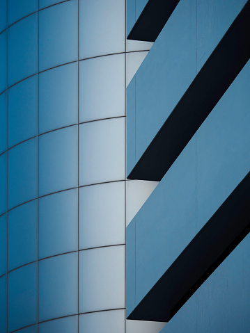 A vertical close-up of a modern building's facade