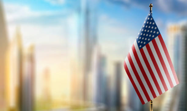 istock Small flags of the USA on an abstract blurry background 1466963486
