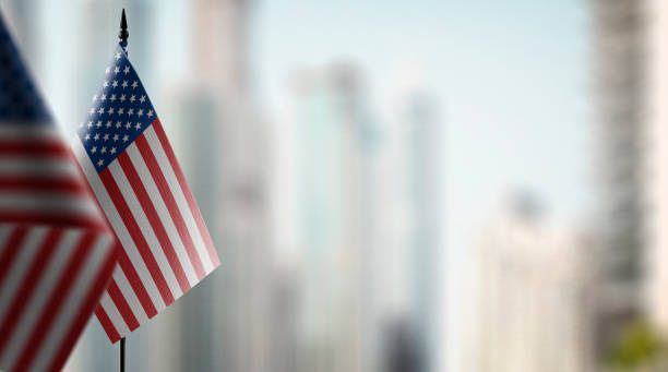 istock Small flags of the USA on an abstract blurry background 1466963570